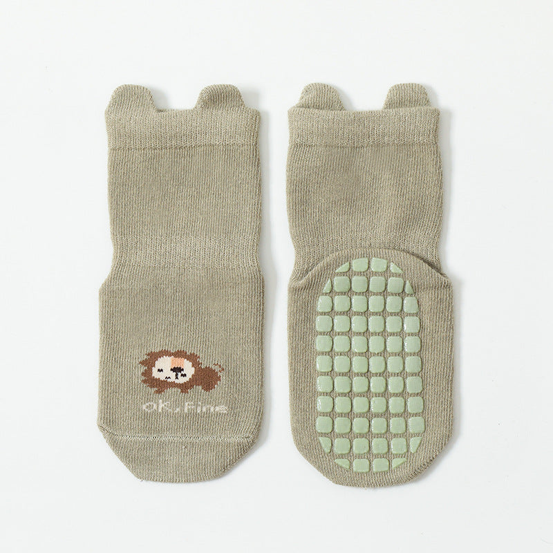 Cute baby socks featuring cartoon animal graphics with a non-slip design, perfect for toddlers.