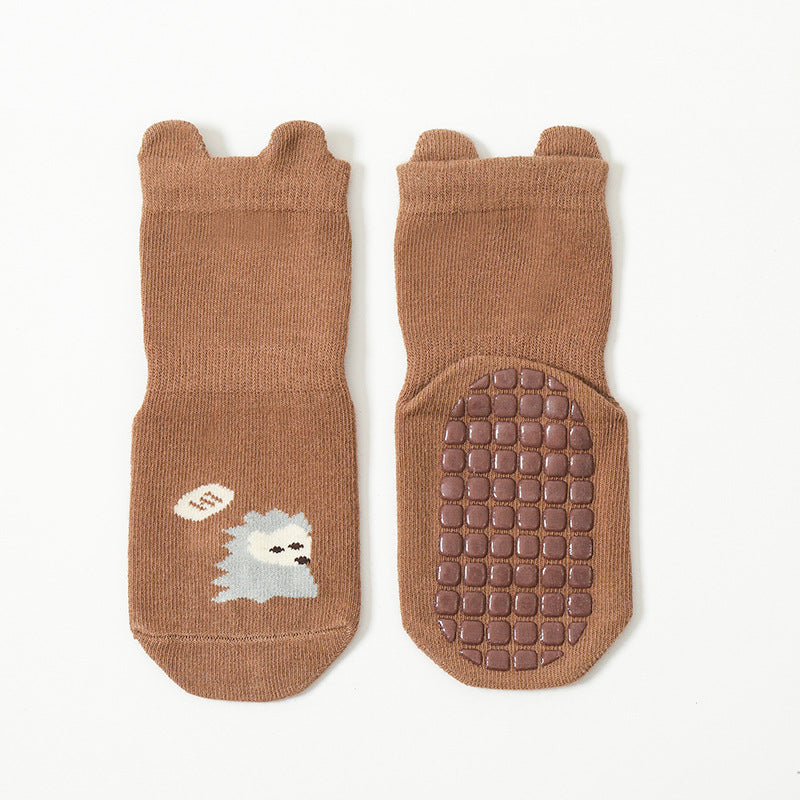 Cute baby socks featuring cartoon animal graphics with a non-slip design, perfect for toddlers.