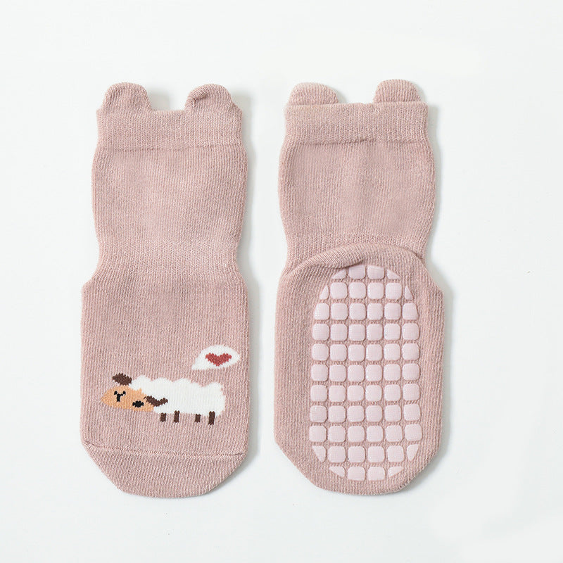 Cute baby socks featuring cartoon animal graphics with a non-slip design, perfect for toddlers.