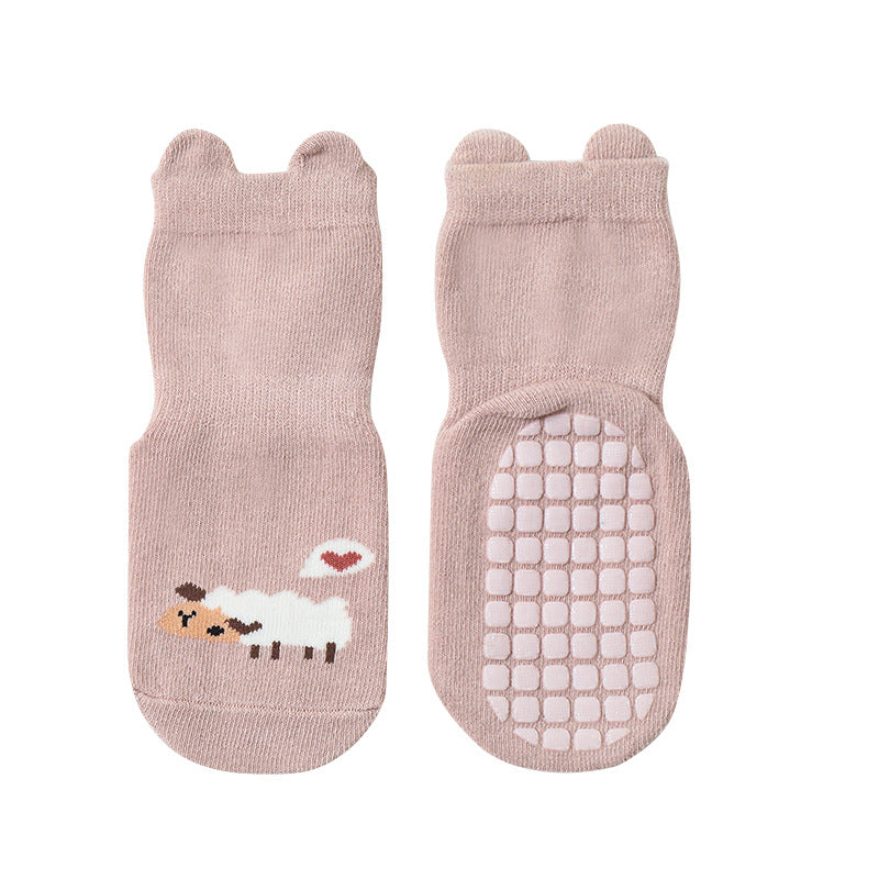 Cute baby socks featuring cartoon animal graphics with a non-slip design, perfect for toddlers.