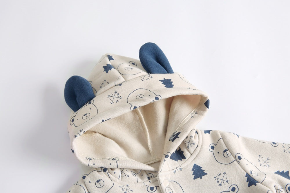 Baby wearing a cute cartoon animal romper with a matching hat, showcasing a playful design in yellow and khaki colors.