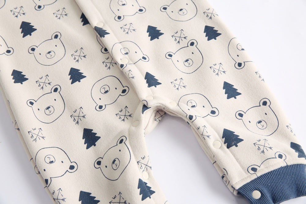 Baby wearing a cute cartoon animal romper with a matching hat, showcasing a playful design in yellow and khaki colors.