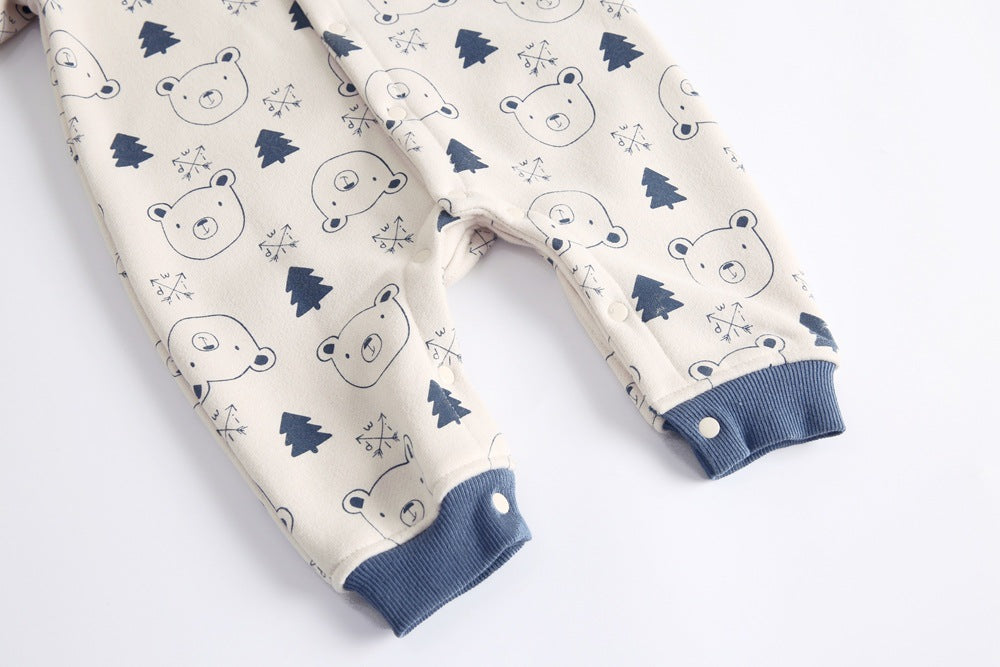 Baby wearing a cute cartoon animal romper with a matching hat, showcasing a playful design in yellow and khaki colors.