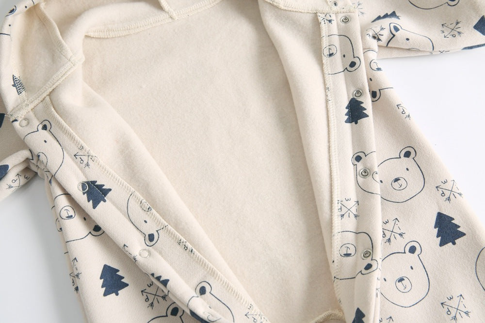 Baby wearing a cute cartoon animal romper with a matching hat, showcasing a playful design in yellow and khaki colors.