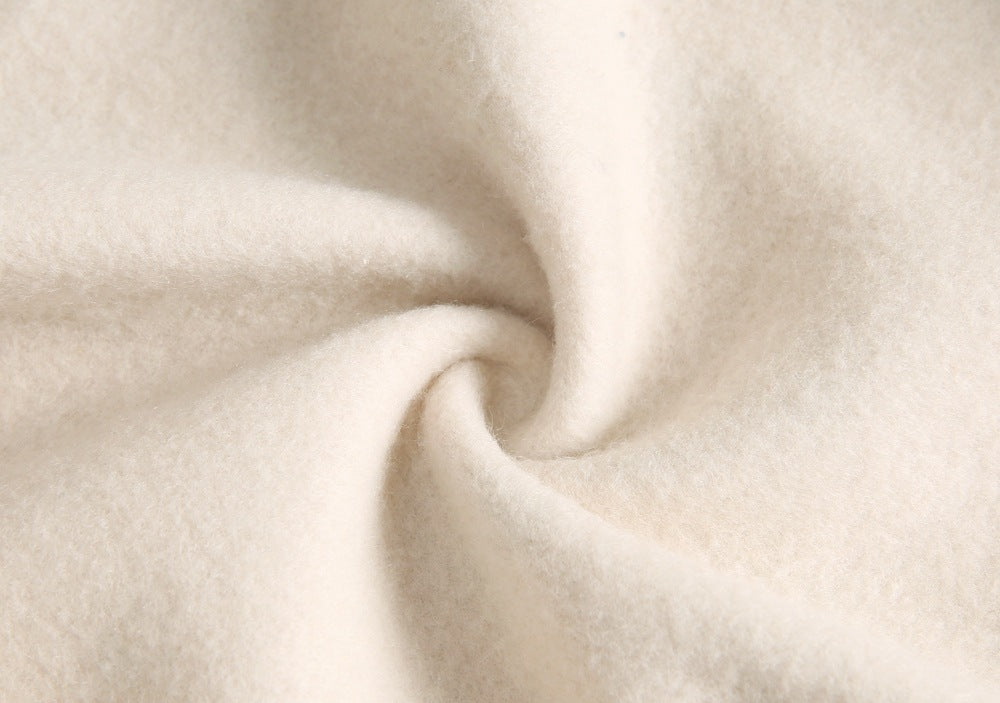 Baby wearing a cute cartoon animal romper with a matching hat, showcasing a playful design in yellow and khaki colors.