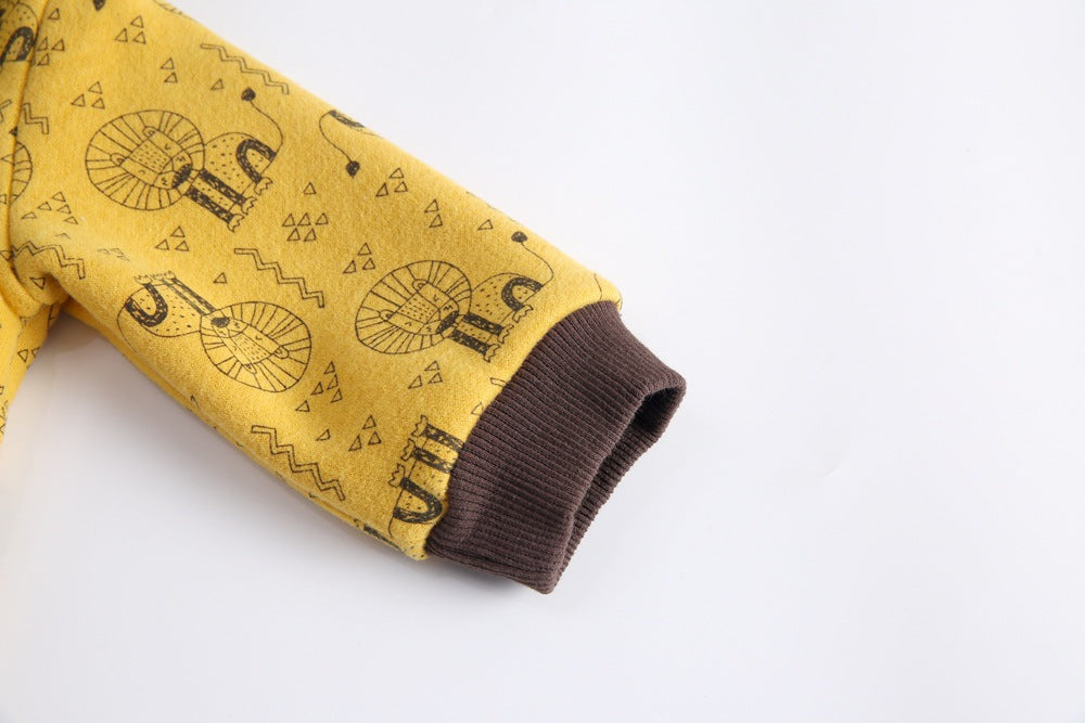 Baby wearing a cute cartoon animal romper with a matching hat, showcasing a playful design in yellow and khaki colors.