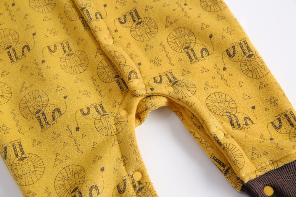 Baby wearing a cute cartoon animal romper with a matching hat, showcasing a playful design in yellow and khaki colors.