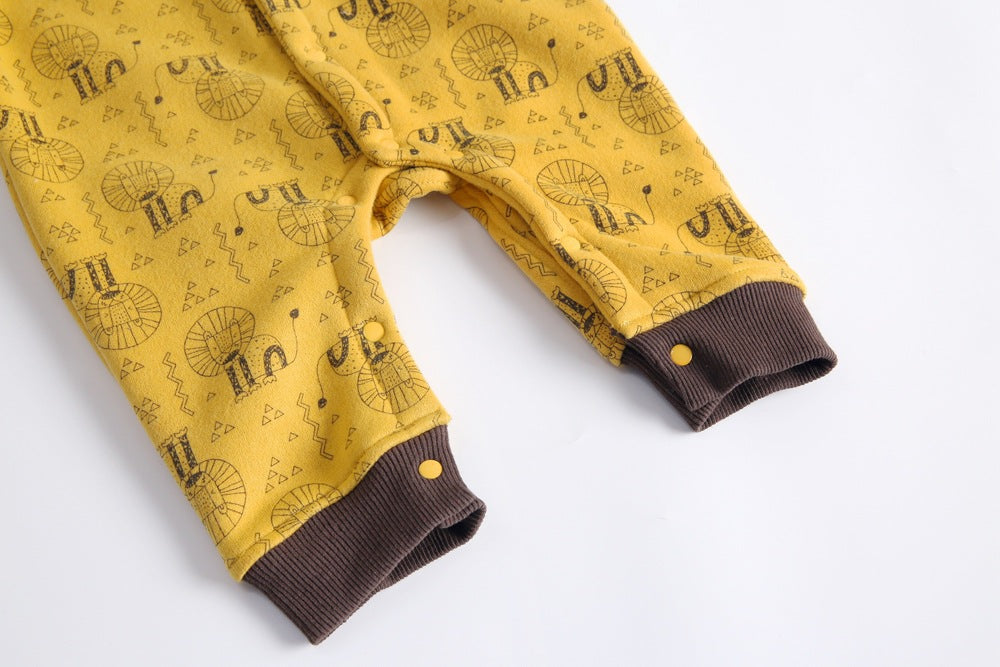 Baby wearing a cute cartoon animal romper with a matching hat, showcasing a playful design in yellow and khaki colors.