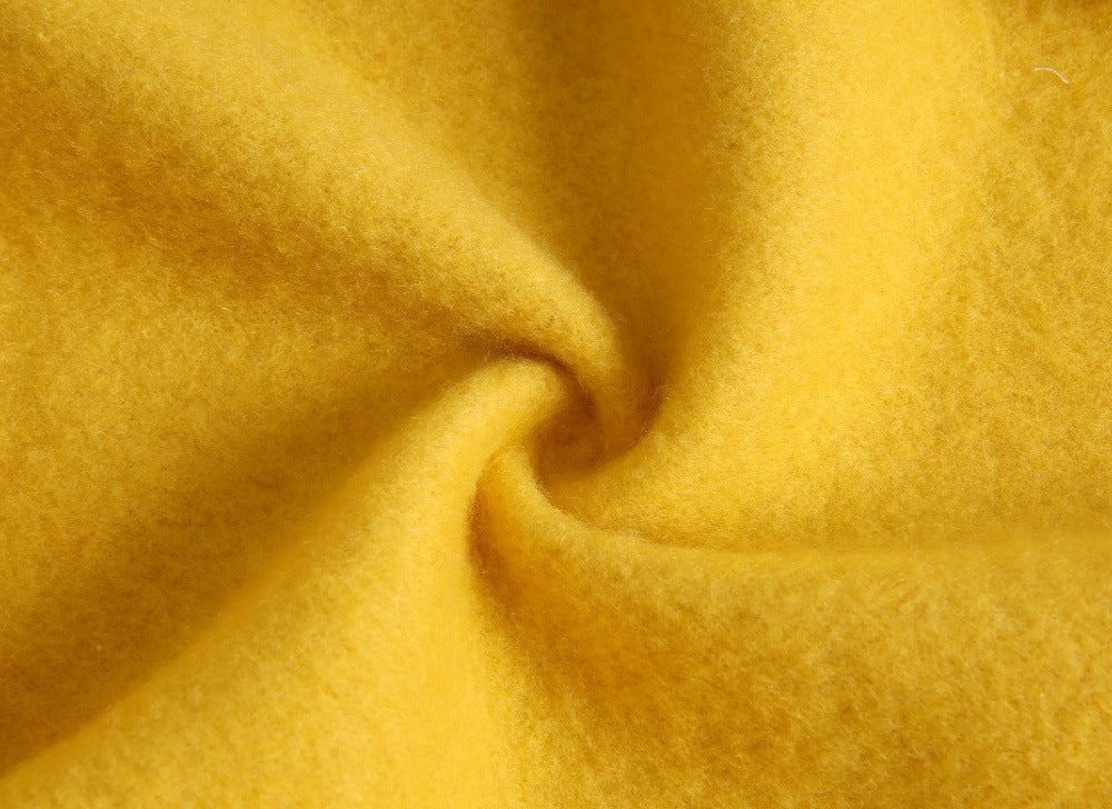 Baby wearing a cute cartoon animal romper with a matching hat, showcasing a playful design in yellow and khaki colors.