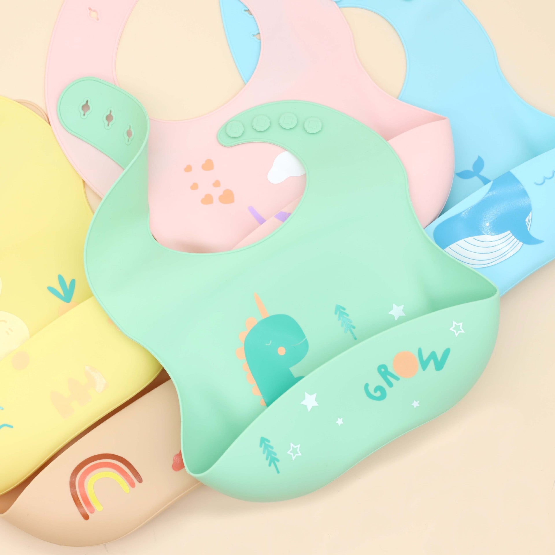 Colorful Baby Cartoon Animal Print Silicone Bibs with adjustable fasteners, perfect for mealtime.
