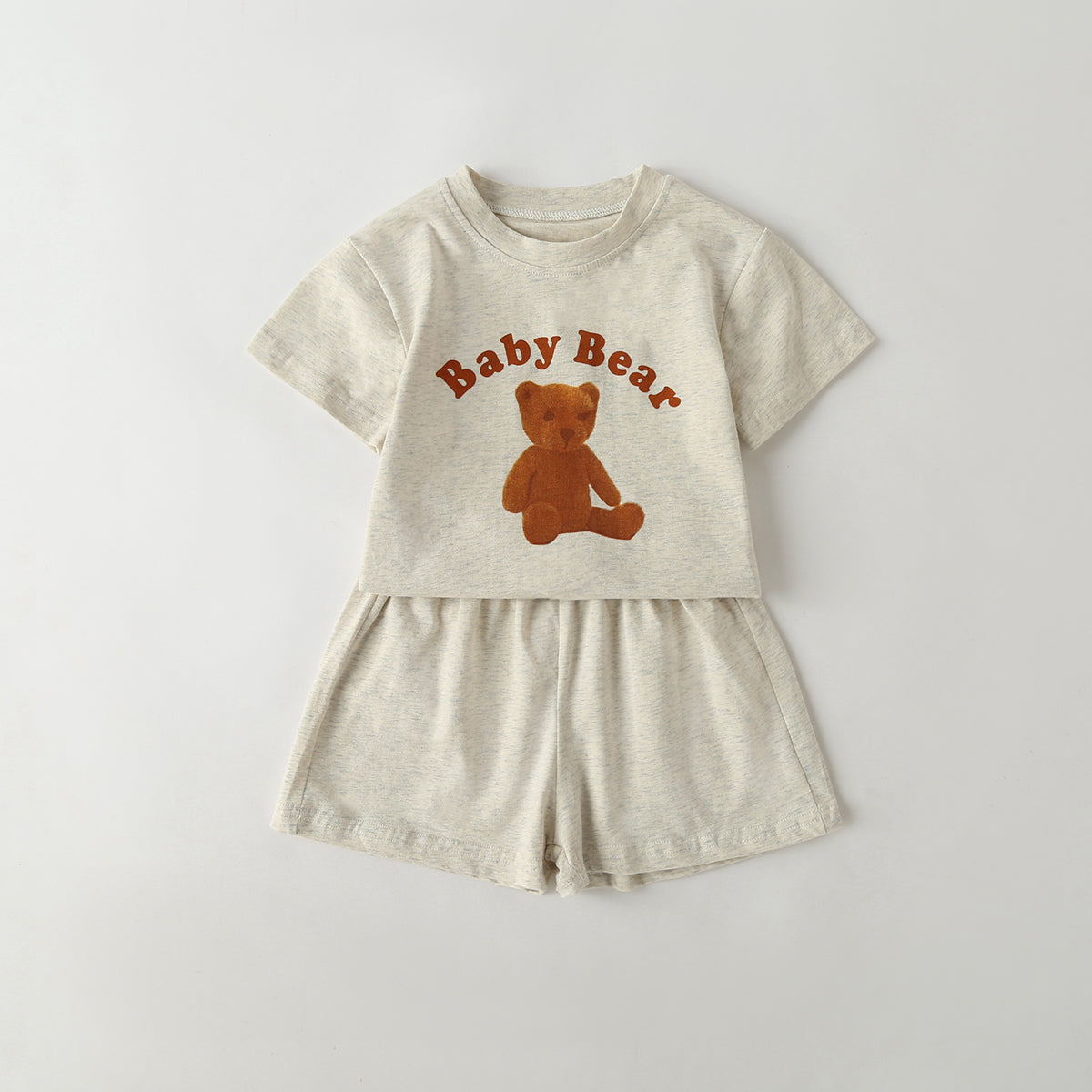 Baby Cartoon Animal & Slogan Pattern Short Sleeved Tee Combo with solid shorts in various colors, perfect for summer wear.