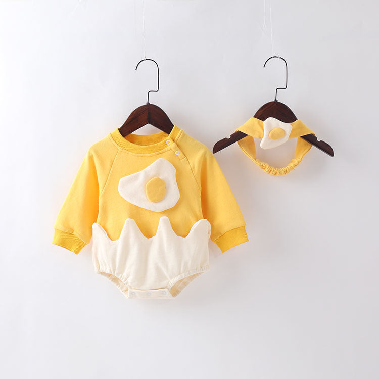Baby wearing a yellow cartoon egg shape bodysuit with a matching headband, showcasing a playful and stylish design.