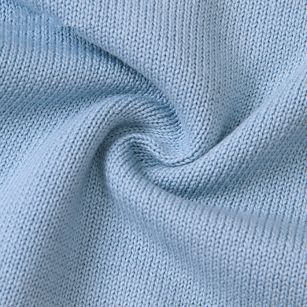 Baby wearing a cute cartoon fox graphic romper with long sleeves, featuring a triangle knitted design in blue and grey colors.