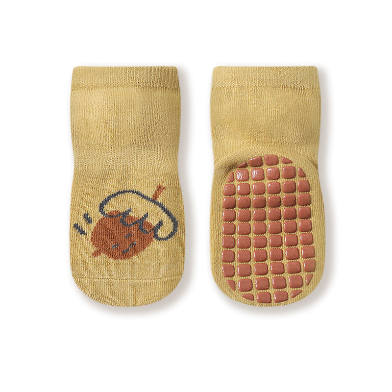 Colorful baby socks with cartoon graphics and non-slip soles, perfect for autumn wear.