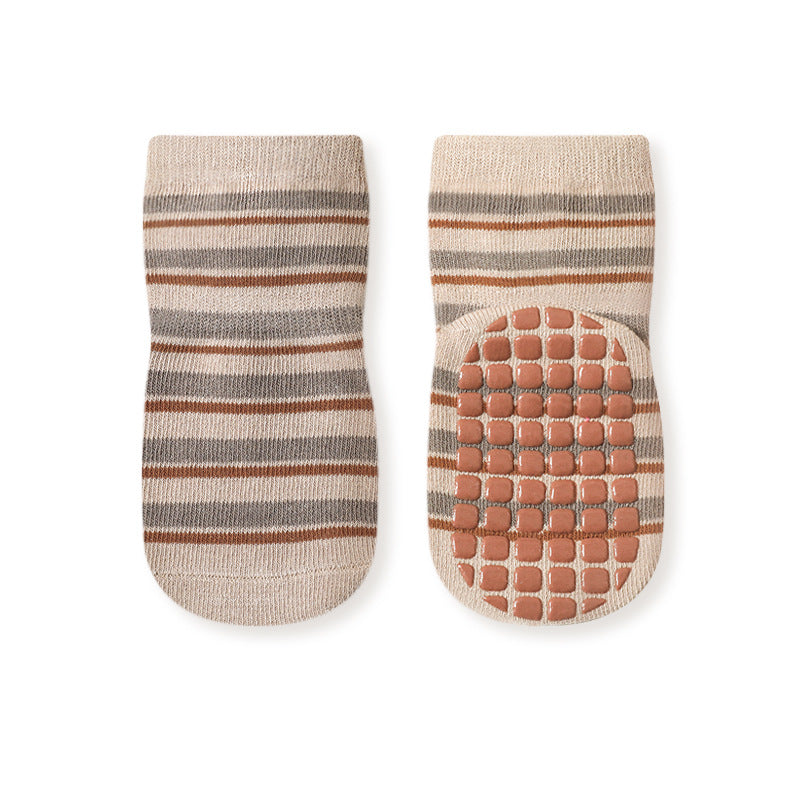 Colorful baby socks with cartoon graphics and non-slip soles, perfect for autumn wear.