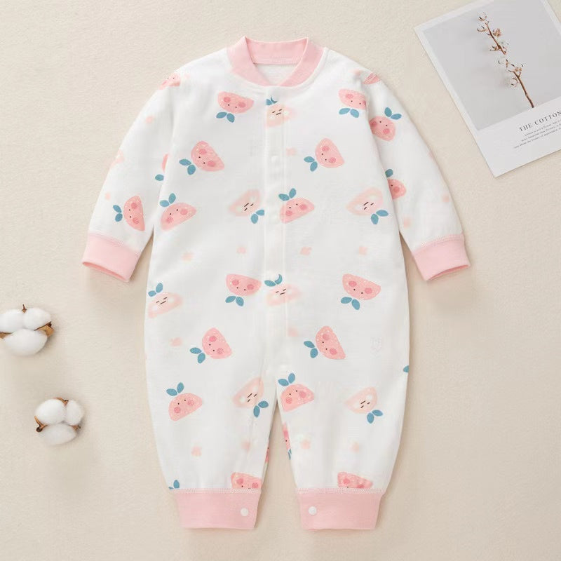 A colorful baby romper featuring a cartoon pattern, button front design, and long sleeves, made from soft cotton fabric.