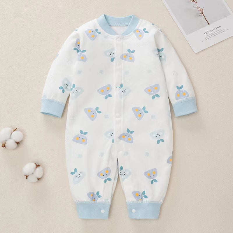 A colorful baby romper featuring a cartoon pattern, button front design, and long sleeves, made from soft cotton fabric.