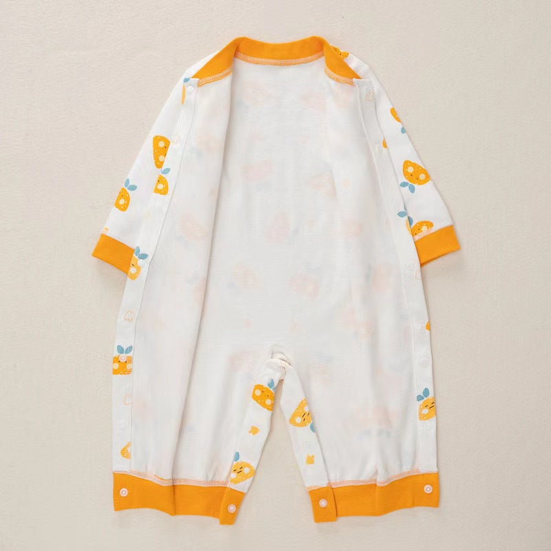 A colorful baby romper featuring a cartoon pattern, button front design, and long sleeves, made from soft cotton fabric.