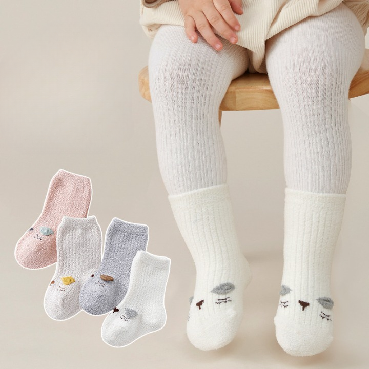 Baby Cartoon Pattern Coral Fleece Mid-Tube Socks in various colors with cute designs, perfect for keeping little feet warm.
