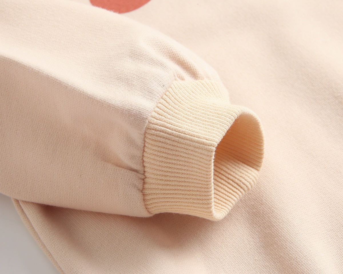 Bright and cozy baby onesie featuring a playful cartoon pattern and a matching hat, perfect for stylish comfort.