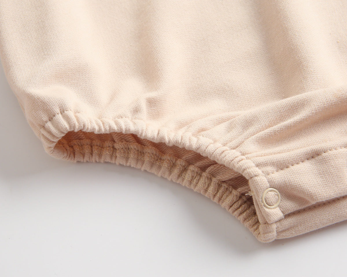 Bright and cozy baby onesie featuring a playful cartoon pattern and a matching hat, perfect for stylish comfort.