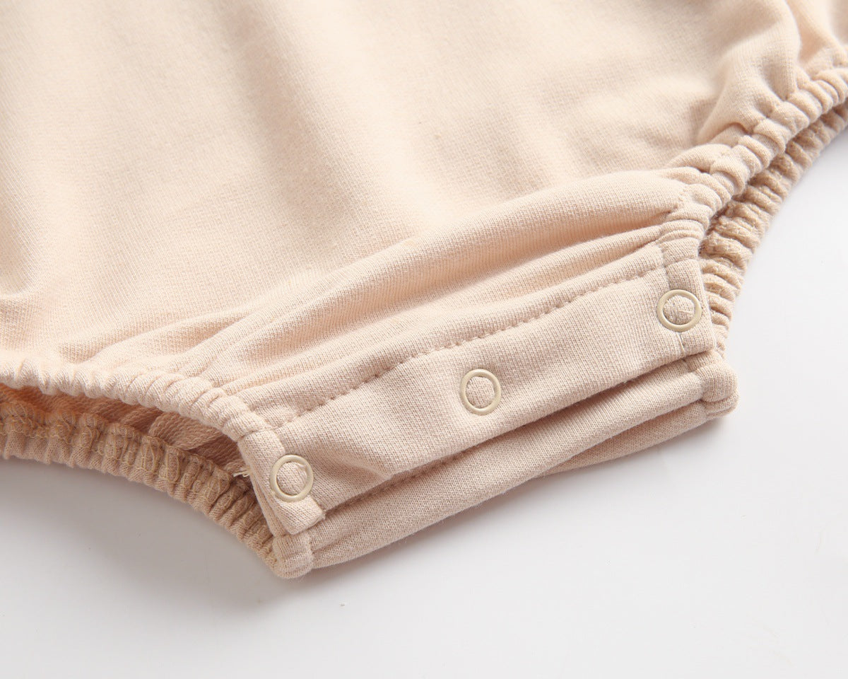 Bright and cozy baby onesie featuring a playful cartoon pattern and a matching hat, perfect for stylish comfort.