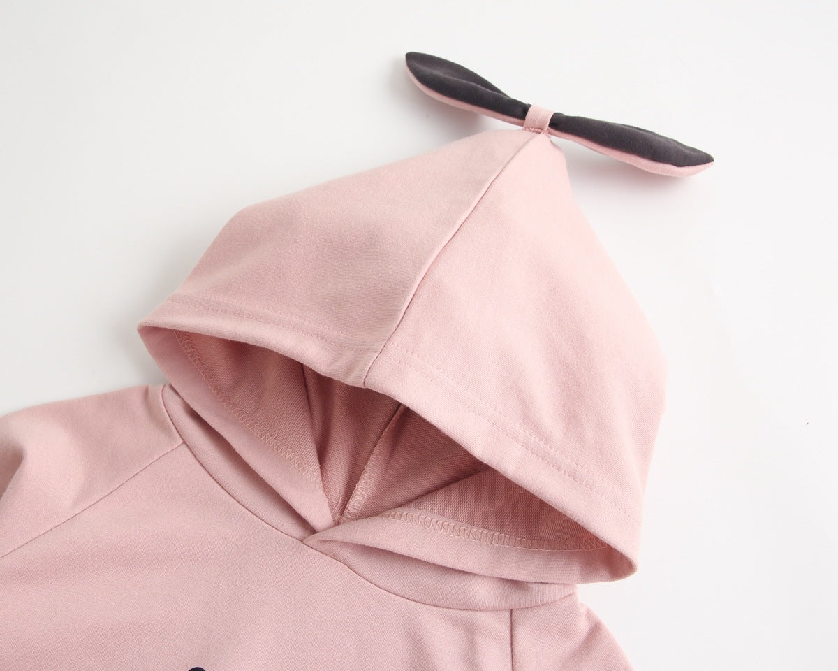 Bright and cozy baby onesie featuring a playful cartoon pattern and a matching hat, perfect for stylish comfort.