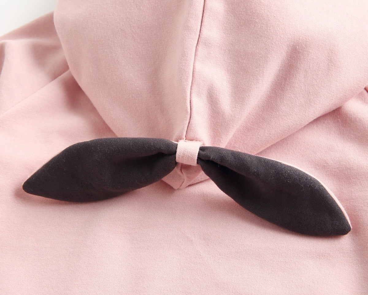 Bright and cozy baby onesie featuring a playful cartoon pattern and a matching hat, perfect for stylish comfort.