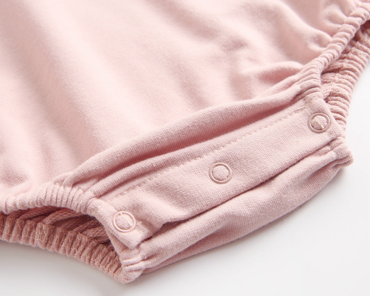 Bright and cozy baby onesie featuring a playful cartoon pattern and a matching hat, perfect for stylish comfort.