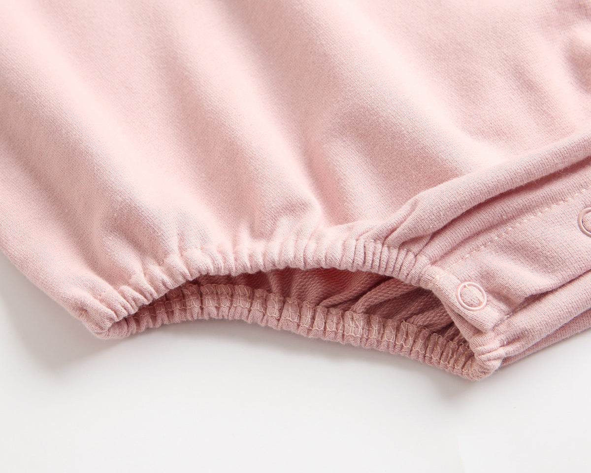 Bright and cozy baby onesie featuring a playful cartoon pattern and a matching hat, perfect for stylish comfort.