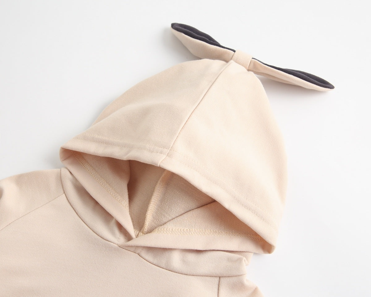 Bright and cozy baby onesie featuring a playful cartoon pattern and a matching hat, perfect for stylish comfort.