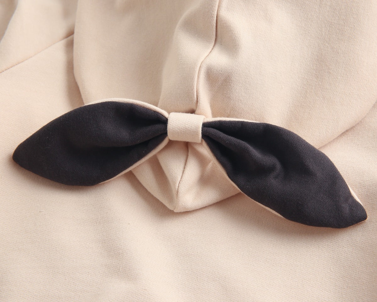 Bright and cozy baby onesie featuring a playful cartoon pattern and a matching hat, perfect for stylish comfort.