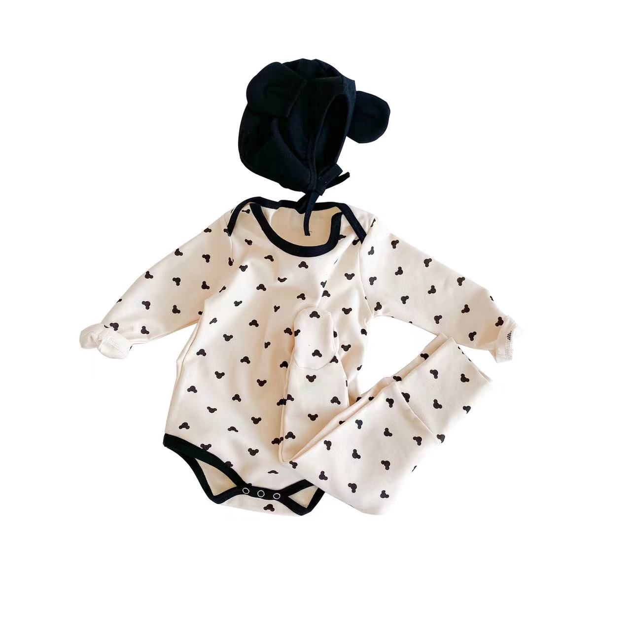 A soft cotton baby onesie and trousers set featuring a colorful cartoon print, available in blue and beige, perfect for baby boys and girls.