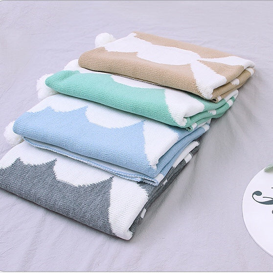 A cozy Baby Cartoon Rabbit & Footprints Embroidered Graphic 3D Tail Blanket featuring a cute rabbit design, perfect for keeping babies warm.