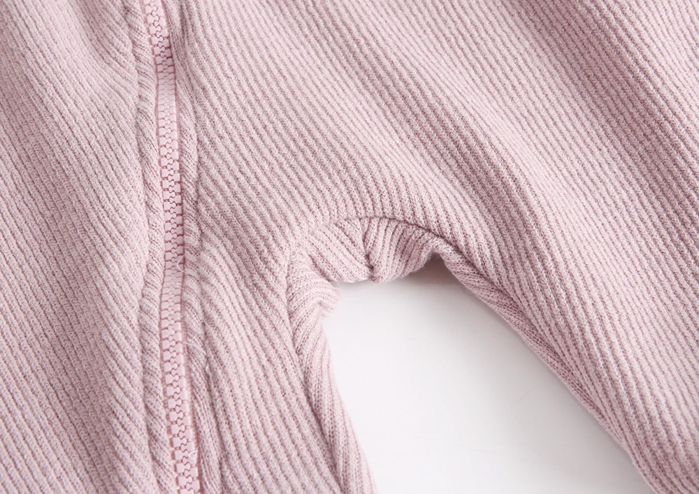 A soft fleece baby romper featuring a playful cartoon shape design, available in black, pink, and brown colors, perfect for autumn and winter.