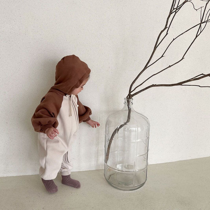 Baby Color Matching Design Zipper Front Romper in black and brown, showcasing its stylish zip front design and soft cotton material.