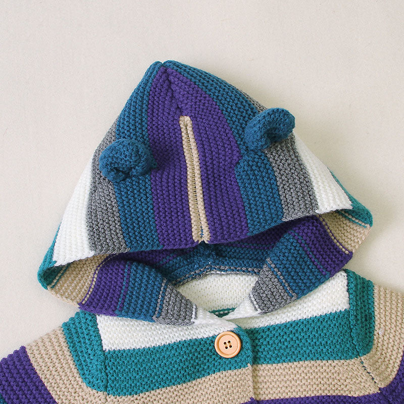 A colorful striped knitted cardigan with button front and matching hat for babies, featuring purple and green colors, perfect for boys and girls.