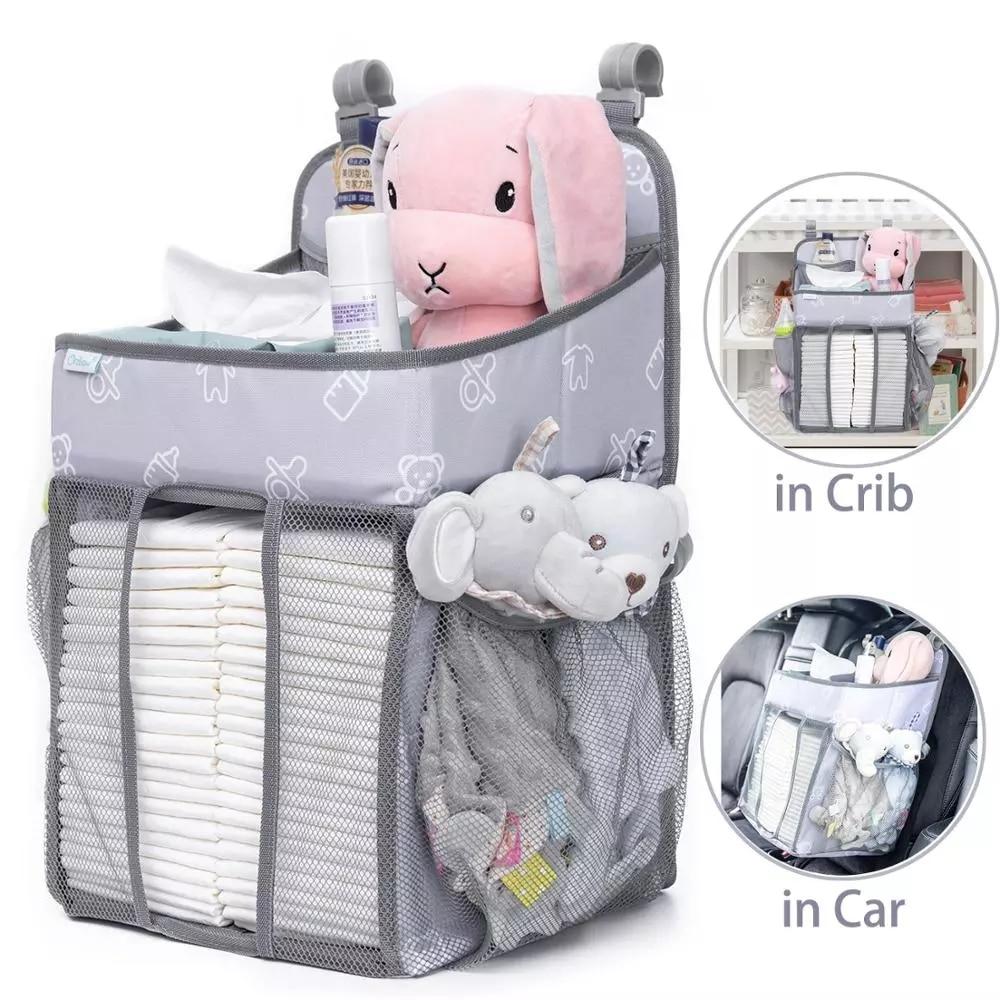 Baby Crib Hanging Storage Bag in cartoon pattern, designed for organizing diapers and baby essentials.