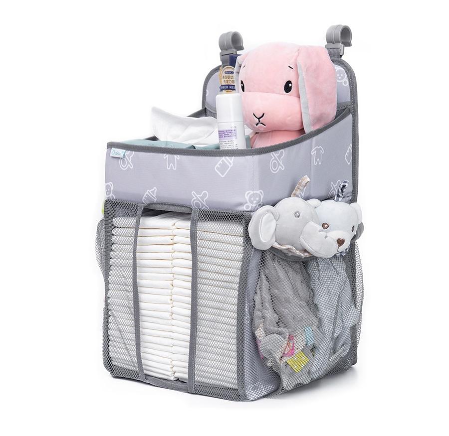 Baby Crib Hanging Storage Bag in cartoon pattern, designed for organizing diapers and baby essentials.