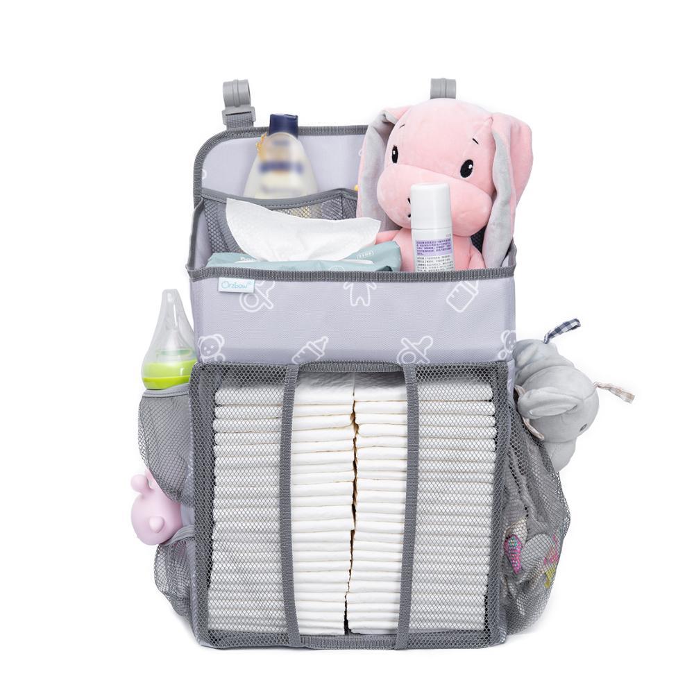 Baby Crib Hanging Storage Bag in cartoon pattern, designed for organizing diapers and baby essentials.