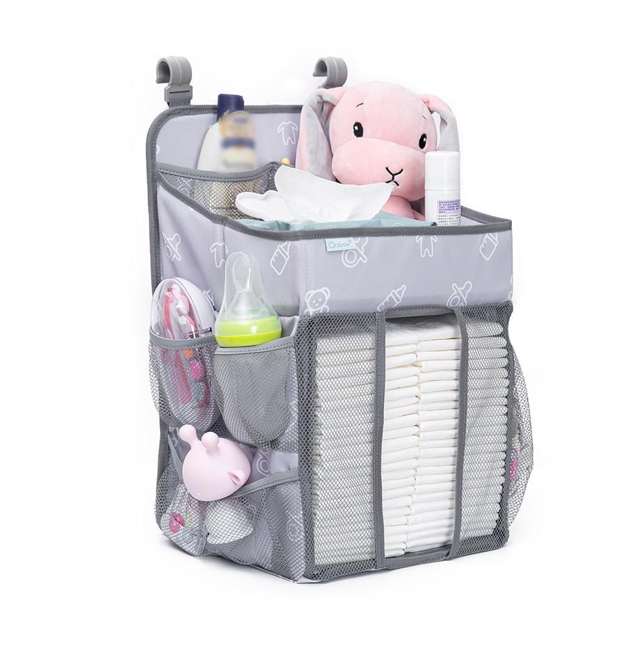 Baby Crib Hanging Storage Bag in cartoon pattern, designed for organizing diapers and baby essentials.