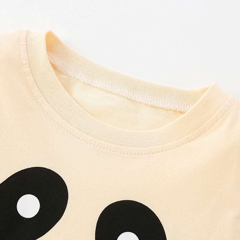 Baby wearing a cute pattern solid color long sleeve shirt in apricot, perfect for spring and autumn.