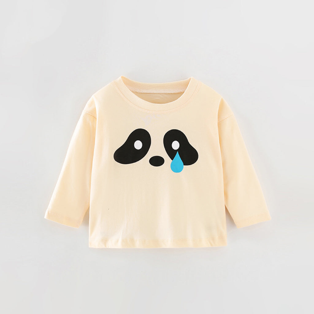 Baby wearing a cute pattern solid color long sleeve shirt in apricot, perfect for spring and autumn.