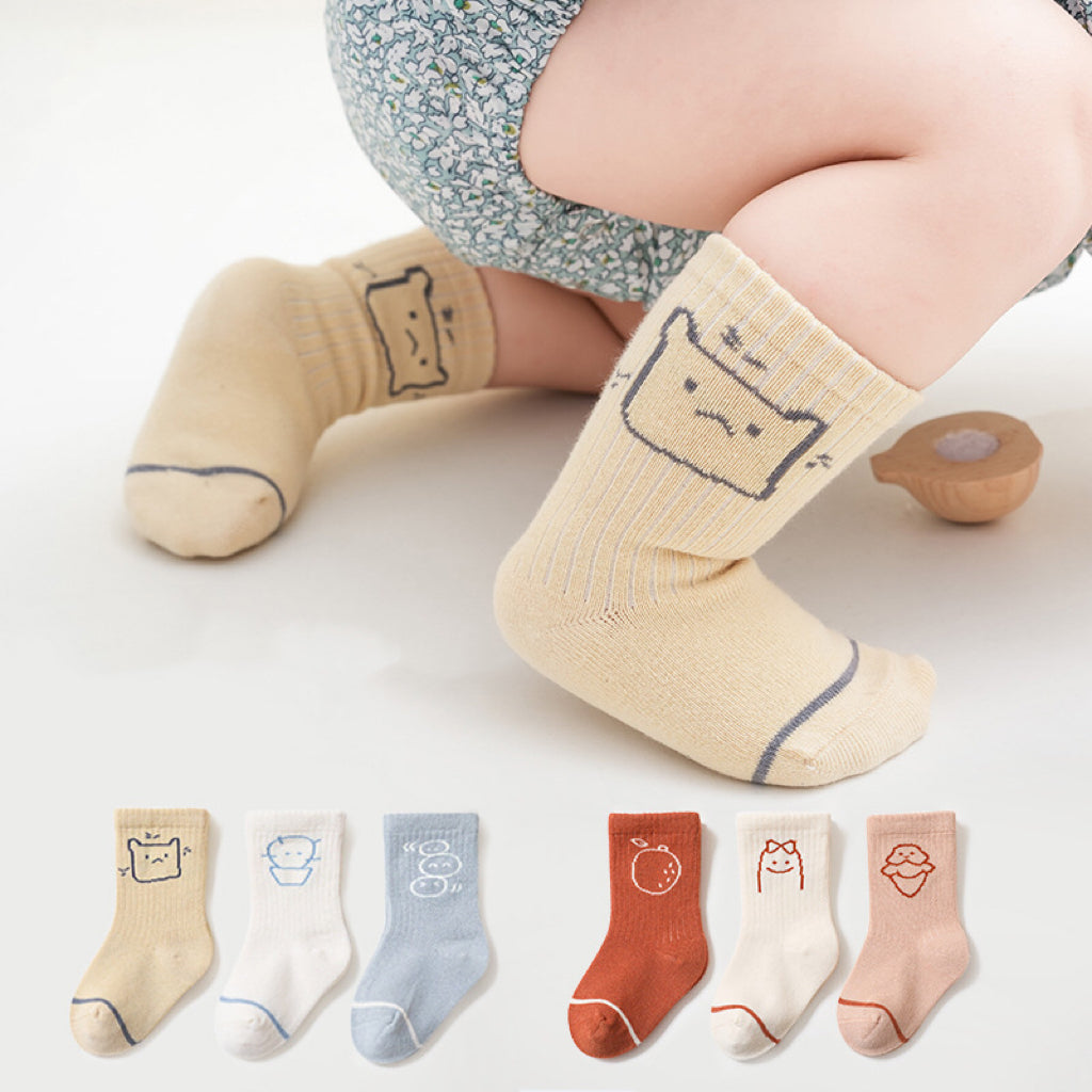A pair of Baby Cute Print Pattern Mid-Tube Cotton Socks featuring colorful animal and cartoon designs, perfect for Spring and Autumn wear.