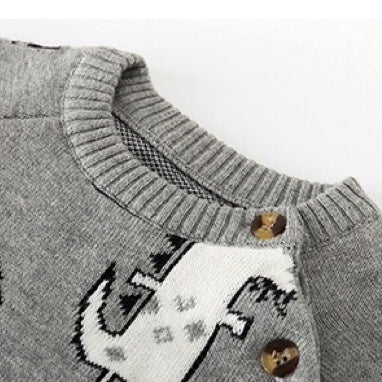 Baby romper featuring a playful dinosaur and pineapple pattern with shoulder button design, made from soft cotton fabric.