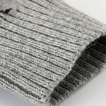 Baby romper featuring a playful dinosaur and pineapple pattern with shoulder button design, made from soft cotton fabric.