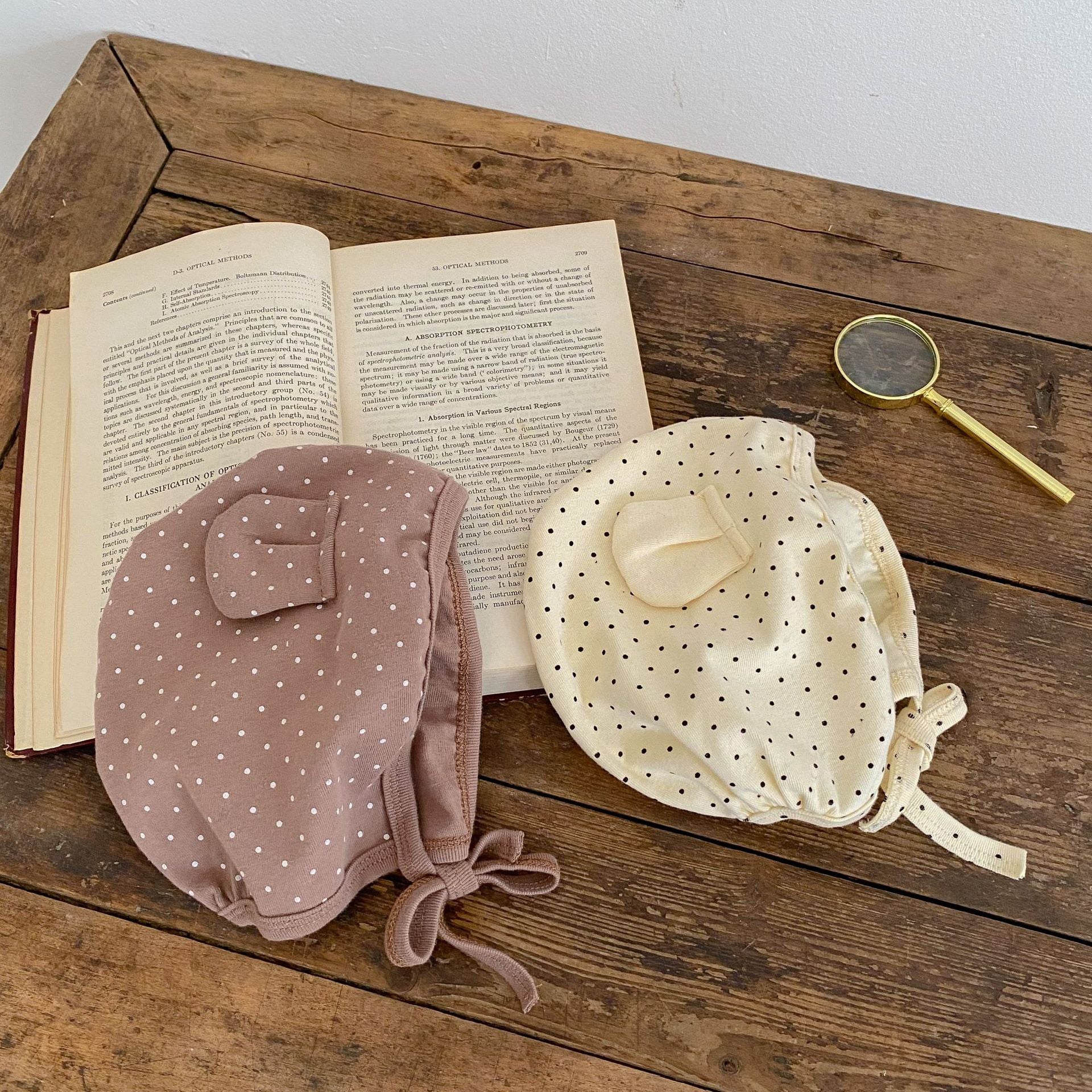 Baby jumpsuit featuring a cartoon bear design with a dot pattern, accompanied by a matching hat, perfect for infants.