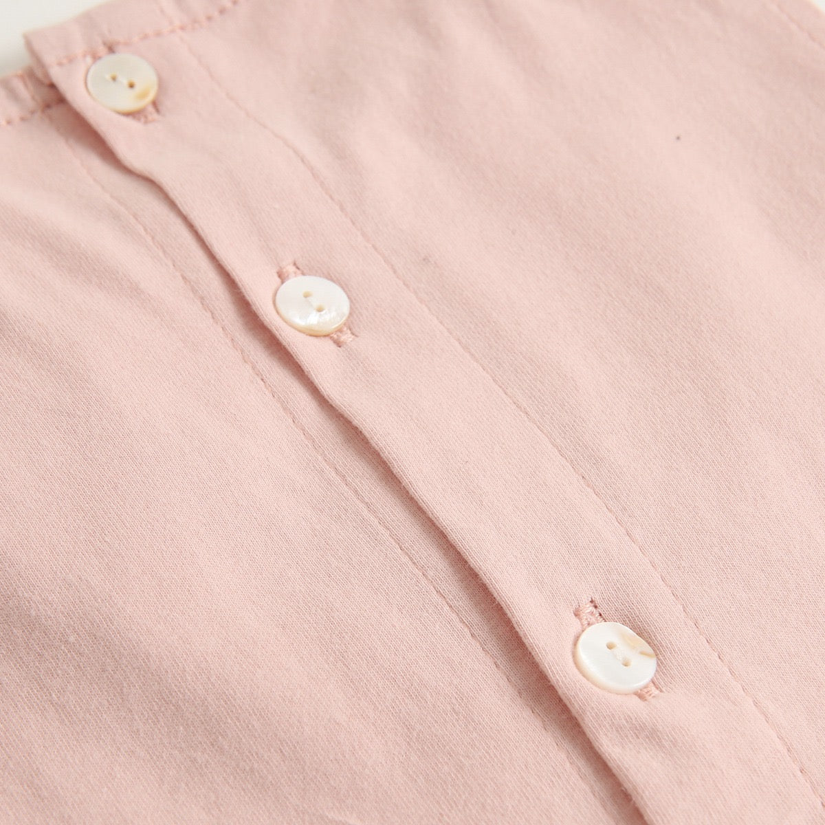 A collection of baby sleeveless onesies in pink and yellow with embroidered patterns, perfect for summer wear.