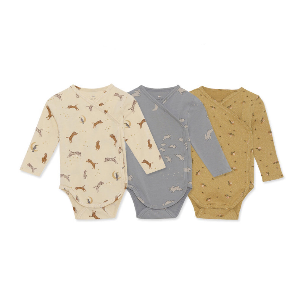 Baby bodysuit featuring floral and animal graphics with envelope collar design in various colors.