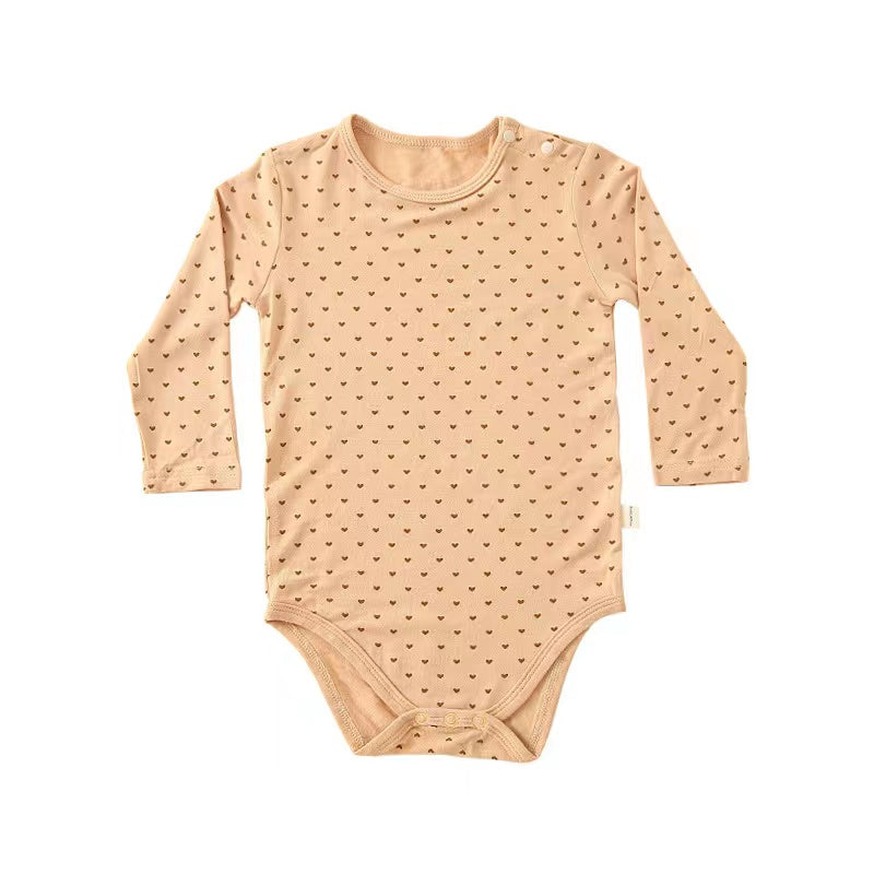 Soft cotton long sleeved onesies for babies featuring floral and heart patterns in white, pink, blue, and apricot colors.